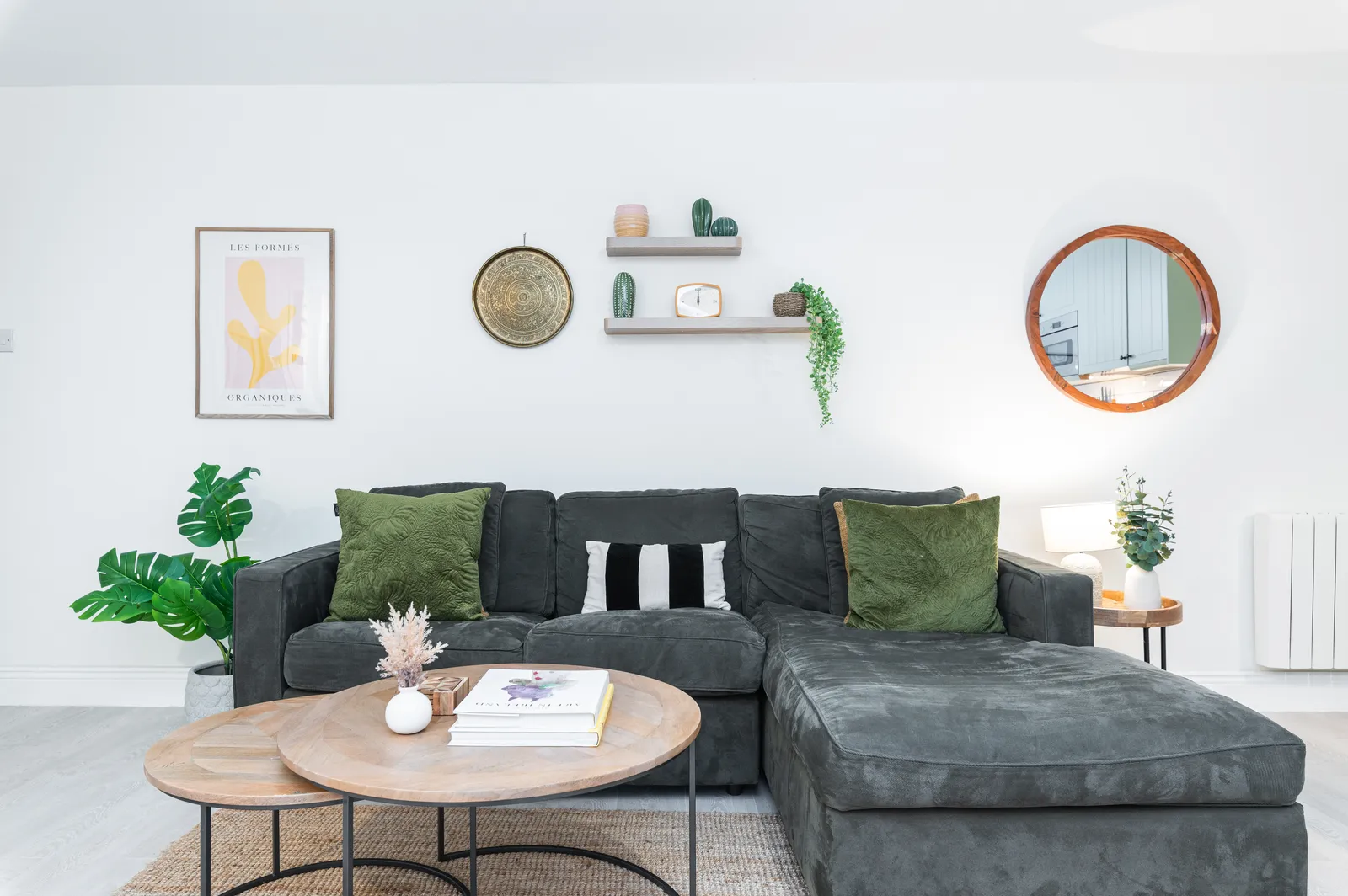 Furnished living room with corner sofa and styled shelving at Cromwell's Fort, Wexford