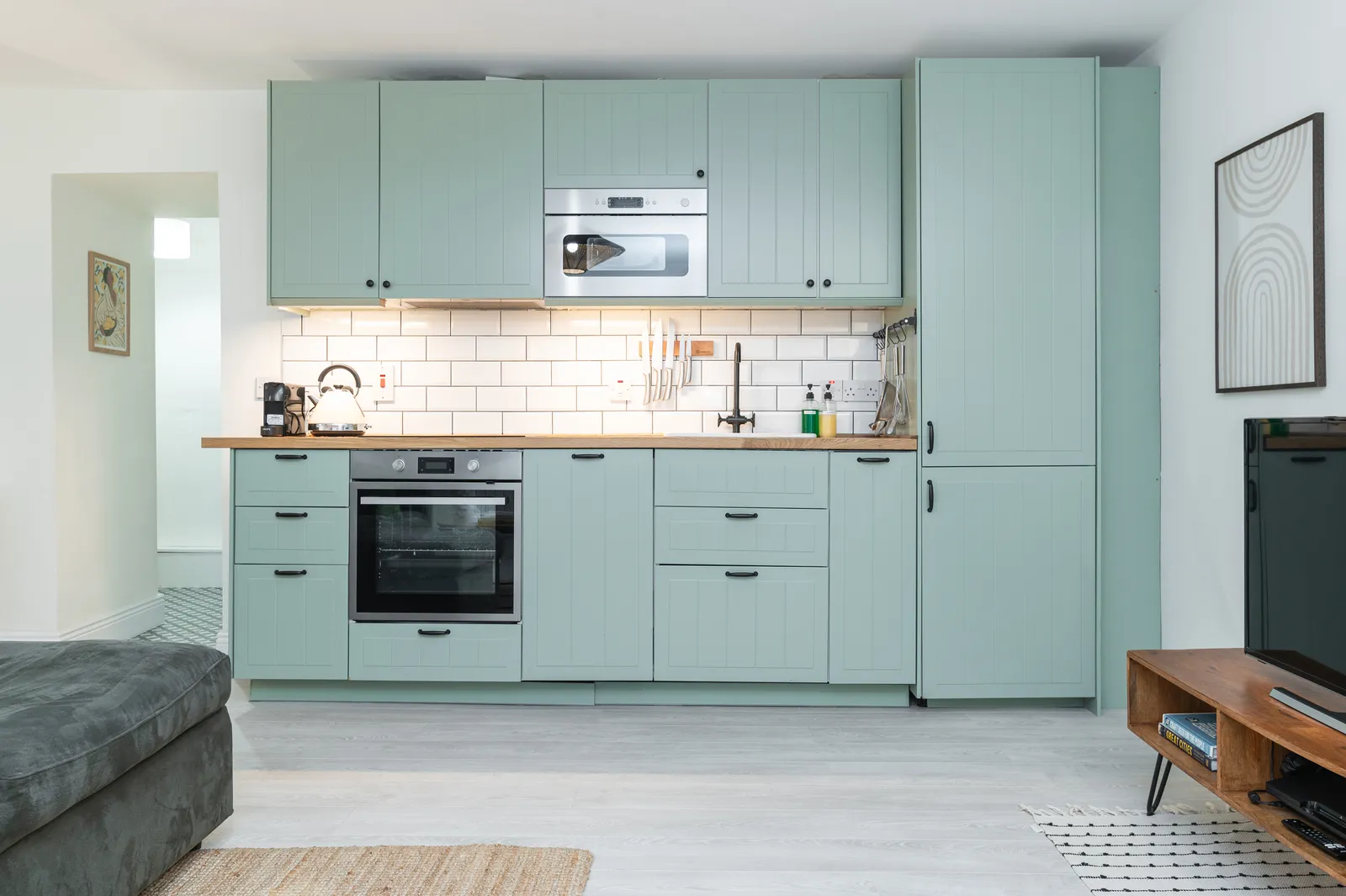 Newly fitted sage green kitchen with metro tiles at Cromwell's Fort, Wexford