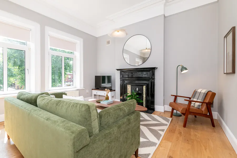 Living room with restored period fireplace at Morehampton Road, Donnybrook