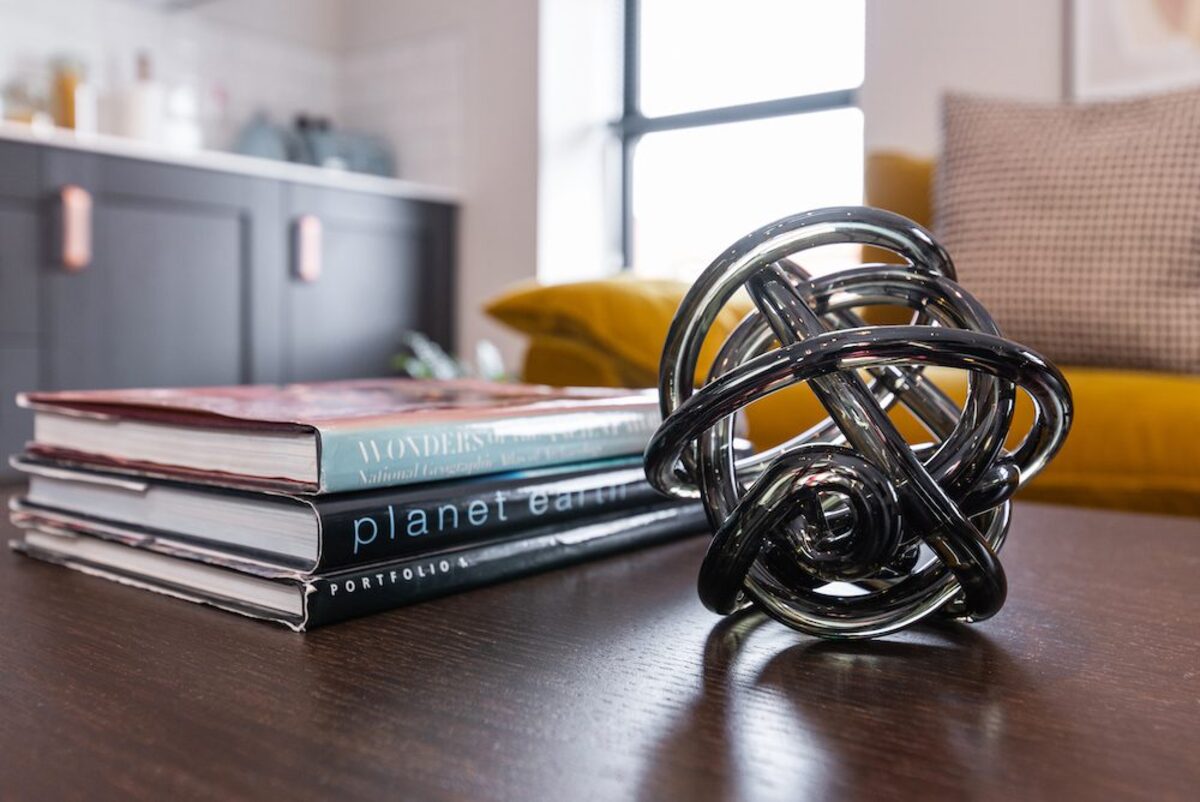 Coffee table with Planet Earth book and glass sculpture in EirStay corporate accommodation Camden Street Dublin 2