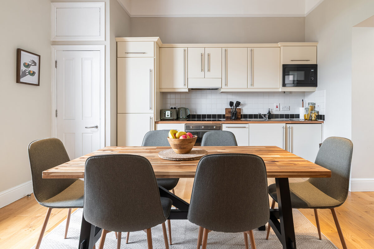 Modern equipped kitchen with dining seating in EirStay corporate short stay apartment Donnybrook Dublin