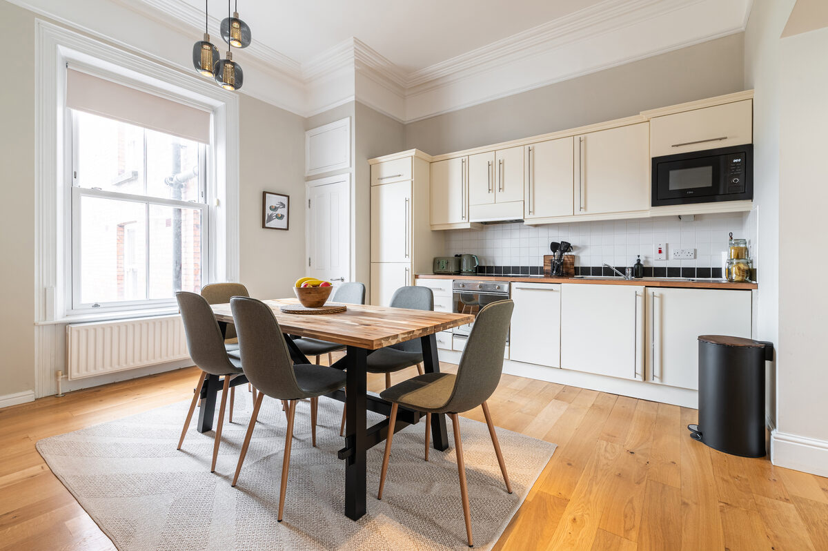 Fully equipped kitchen with dining table for six in EirStay short stay corporate serviced apartment Dublin 4