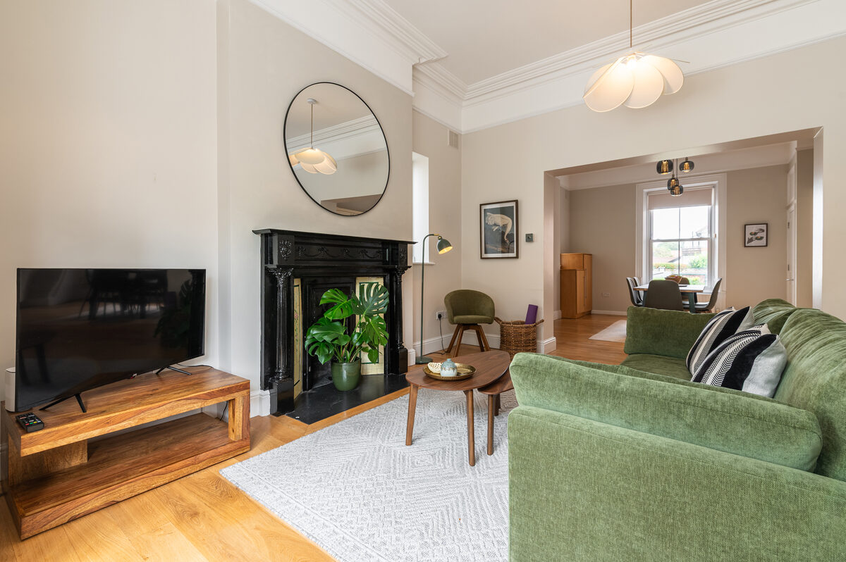 Smart TV and lounge area with open plan dining in EirStay corporate short stay serviced apartment Donnybrook