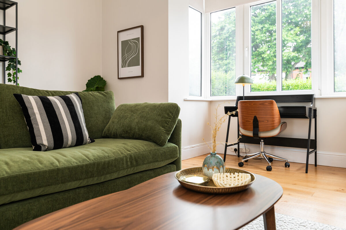 Close-up of workspace desk and sofa in EirStay short stay corporate serviced apartment Donnybrook Dublin 4