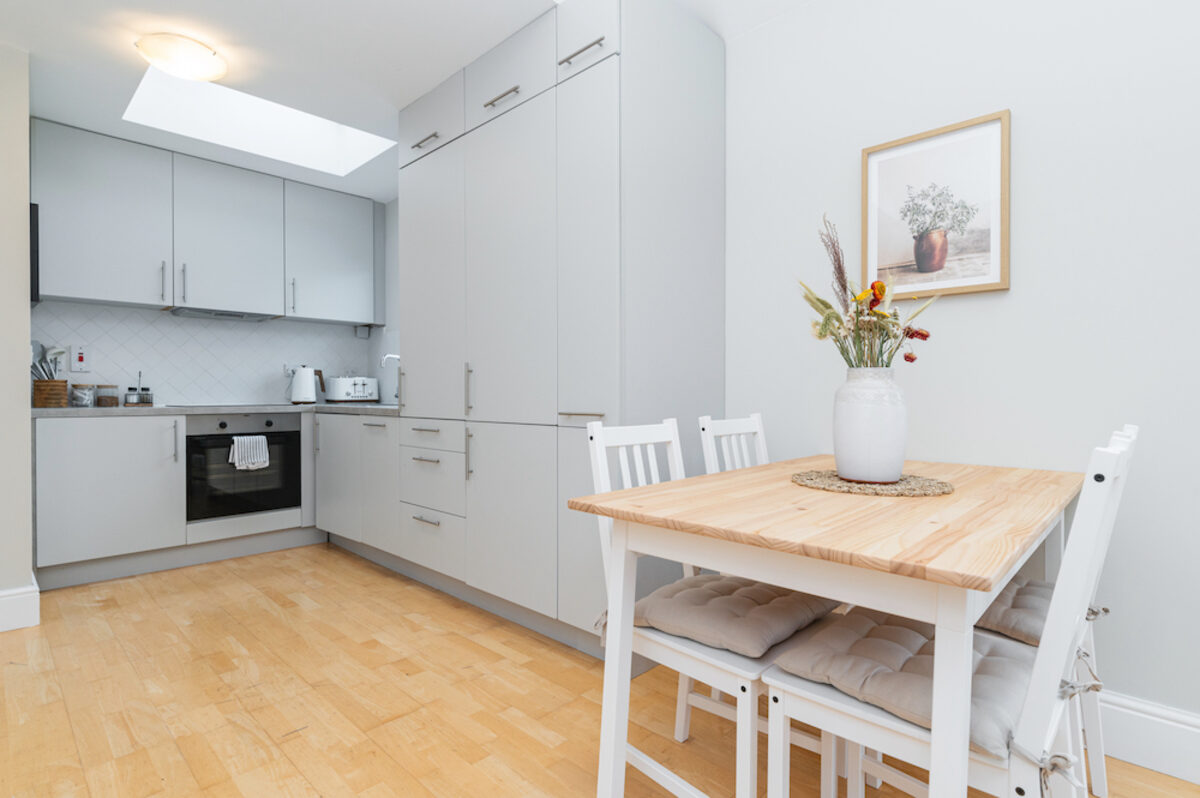 Fully equipped kitchen with dining table and skylight in EirStay corporate short stay apartment Morehampton Road Dublin 4