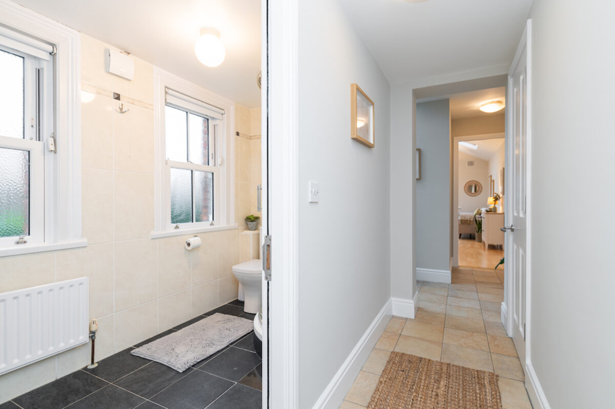 Tiled hallway connecting bathroom and living areas in EirStay serviced apartment Morehampton Road Donnybrook Dublin 4