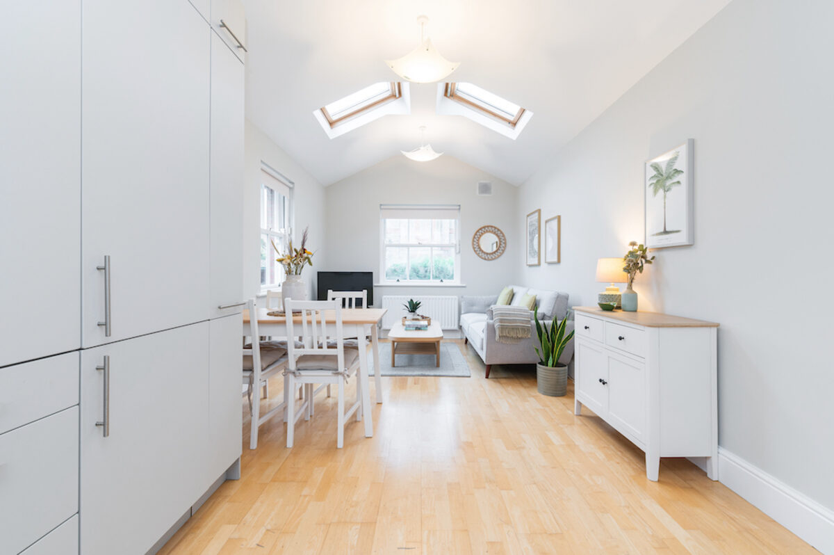 Spacious living dining room with vaulted ceiling and skylights in EirStay serviced apartment Morehampton Road Dublin 4