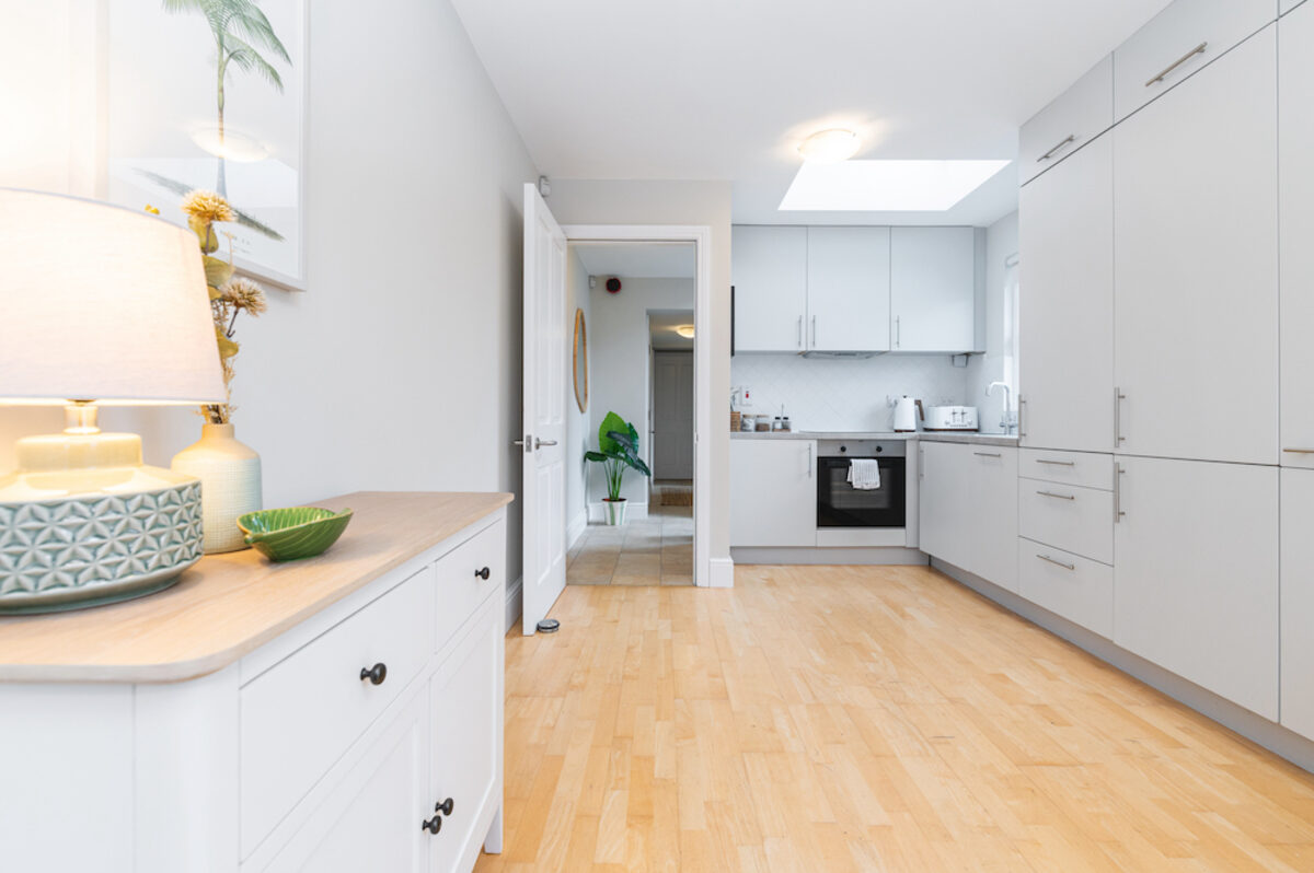 Modern open plan kitchen with hardwood floors in EirStay serviced apartment Morehampton Road Donnybrook Dublin 4
