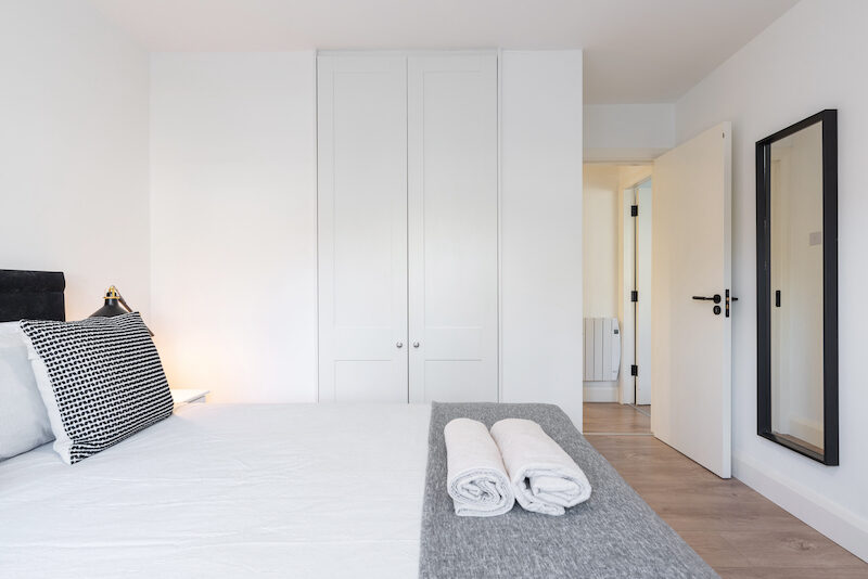 Built-in wardrobes and full-length mirror in EirStay Islandbridge one-bedroom apartment Dublin 8