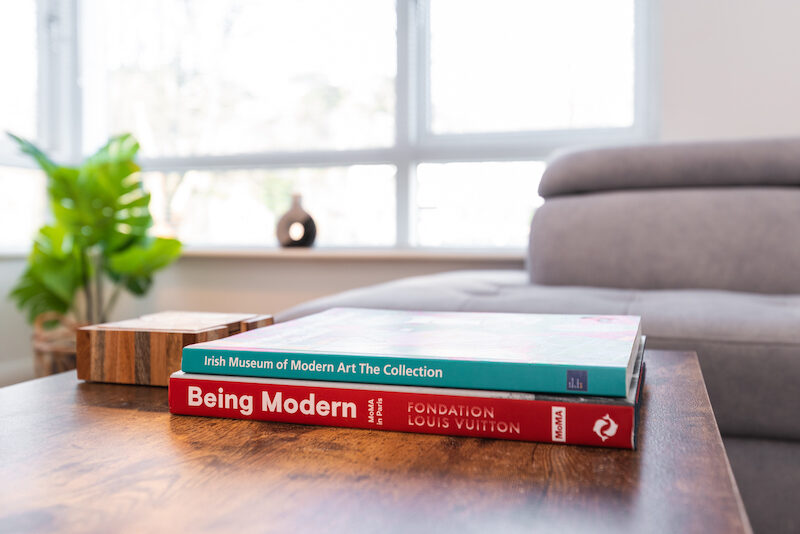 Coffee table books including Irish Museum of Modern Art collection in EirStay Islandbridge apartment — a considered Dublin 8 corporate stay