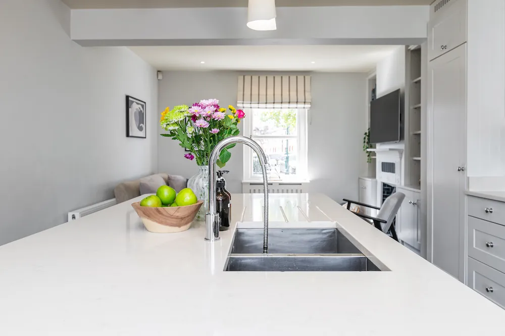 Kitchen island and open-plan living space at Sandford Gardens in Dublin 8