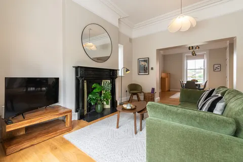 Smart TV and lounge area with open plan dining in EirStay corporate short stay serviced apartment Donnybrook