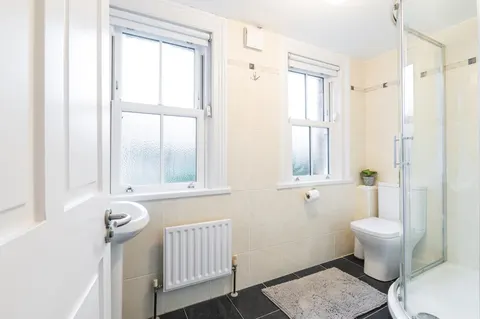 Modern bathroom with walk-in shower in EirStay corporate short stay apartment Morehampton Road Donnybrook Dublin 4