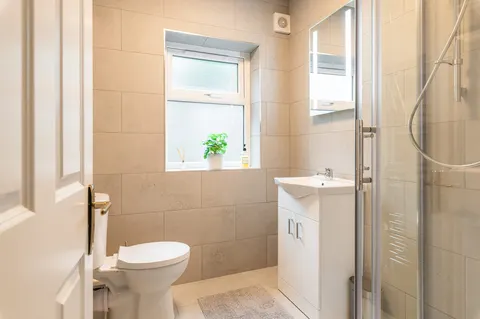 Modern tiled bathroom with walk-in shower in EirStay corporate stay serviced apartment Ranelagh Dublin 6