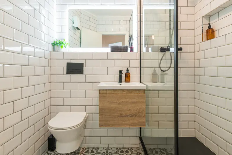 Rathgar apartment bathroom with walk-in shower, vanity and white tiled walls