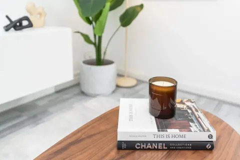 Coffee table with books, candle and flowers in the Rathgar living room