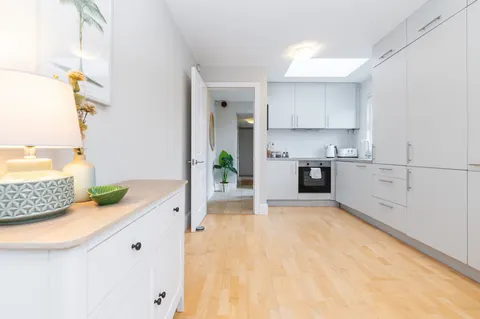 Modern open plan kitchen with hardwood floors in EirStay serviced apartment Morehampton Road Donnybrook Dublin 4